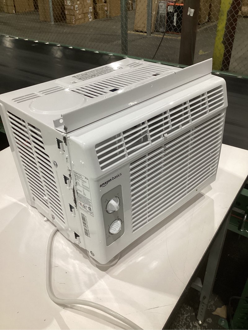 Condition photo showing As Is for (not tested)amazon basics 5000-btu small window air conditioner, up to 150 sqf, window ac units with cool and fan functions, washable filter, adjustable window kit, intuitive mechanical controls, white white 5000 btud