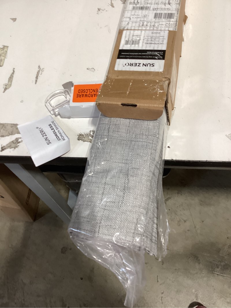 Condition photo showing New/Like New for sun zero seraphina textured 100% total blackout cordless roman shade, gray, 29" w x 64" h gray 29"w x 64"h