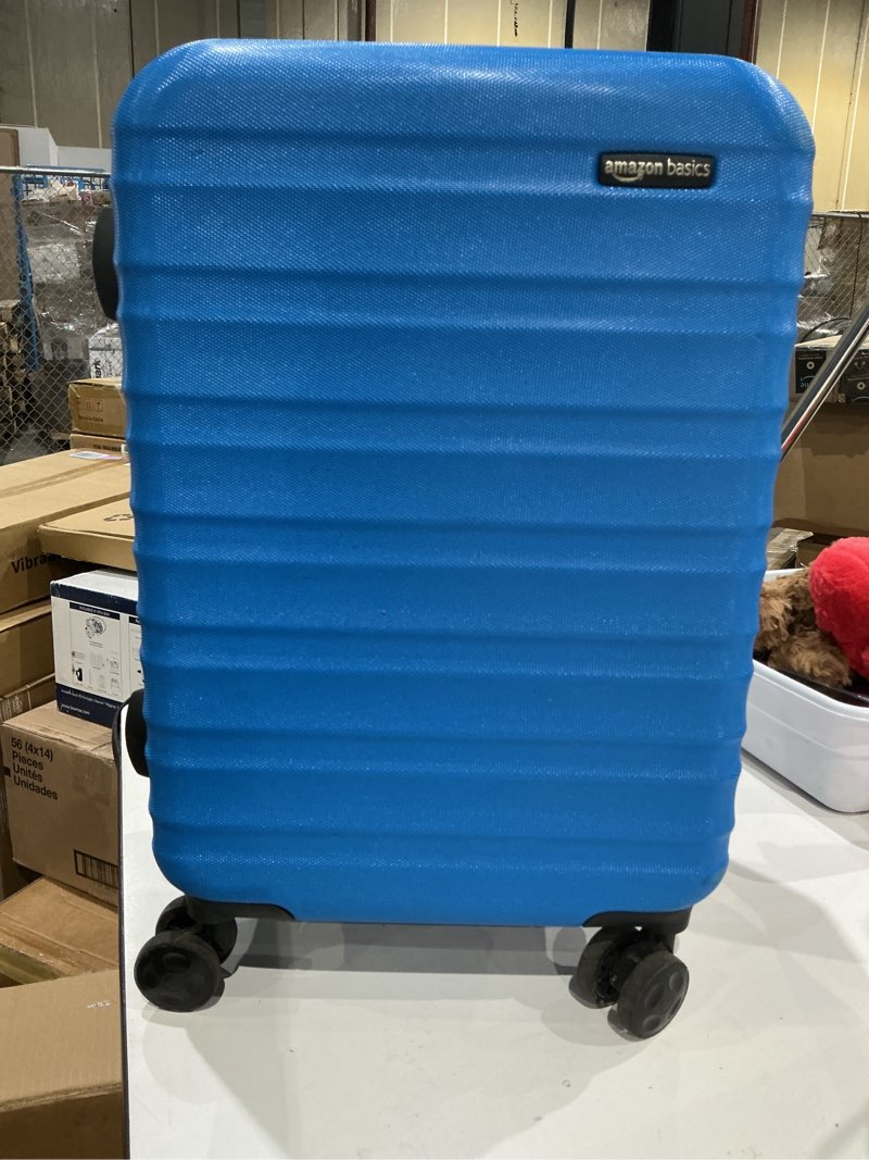 Condition photo showing Good Condition for amazon basics 21" hardside carry-on luggage, hardshell suitcase with wheels, expandable for up to 25% more space, with scratch-resistant surface, four multi-directional wheels, light blue light blue carry-on