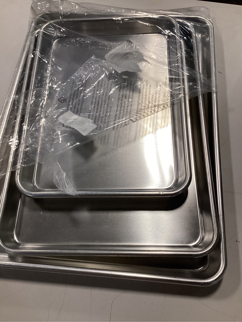Condition photo showing Good Condition for Nordic Ware Naturals 3 Piece Set - USA Made Aluminum Commercial Quality Sheet Pan for Baking or Roasting, Encapsulated Galvanized Steel Rim Prevents Warping; Half Sheet, Jelly Roll and Quarter Sheet 3-Piece Pan Set
