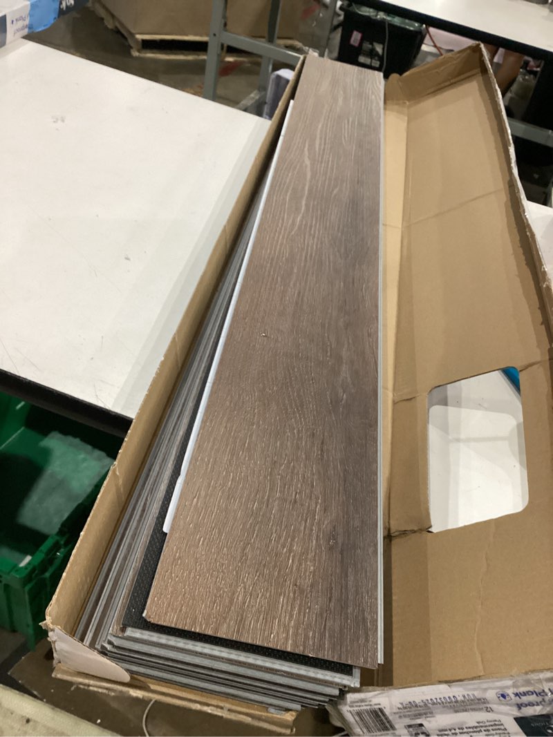 Condition photo showing Good Condition for style selections penny oak brown 6-mil x 6-in w x 48-in l waterproof interlocking luxury vinyl plank flooring (23.278-sq ft/ carton)