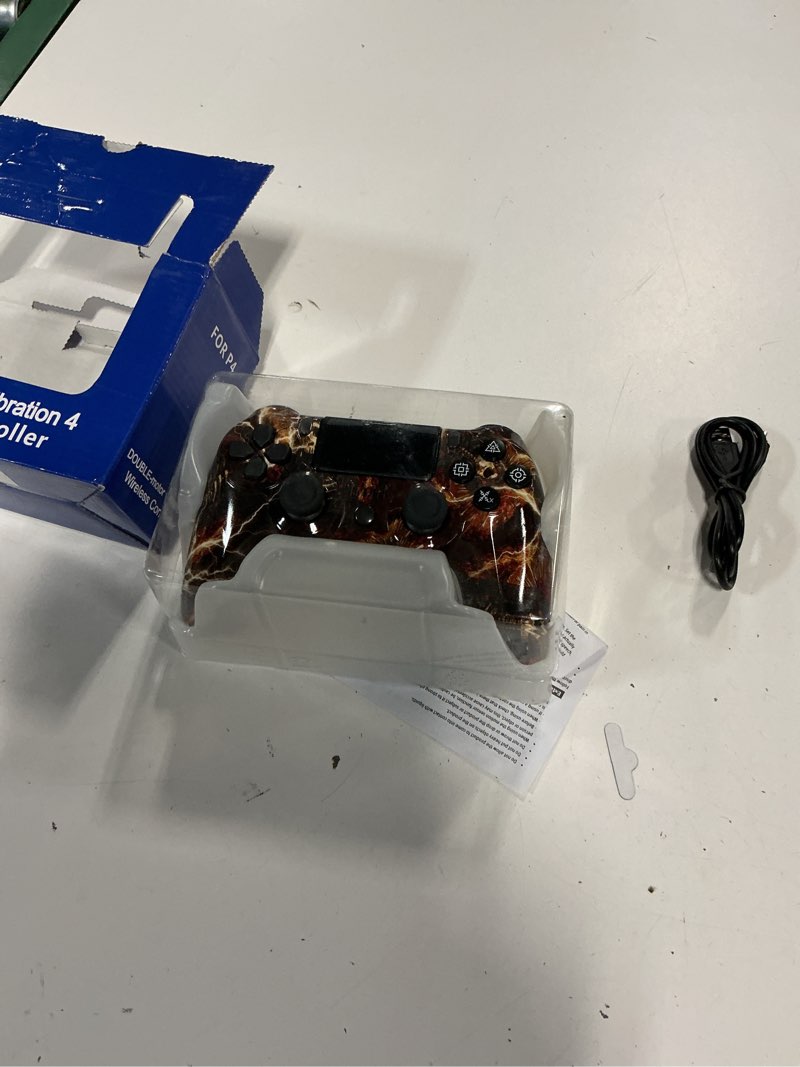 Condition photo showing New/Like New for third-party wireless controller for the playstation 4, featuring a "fire skull" or lightning graphic design
