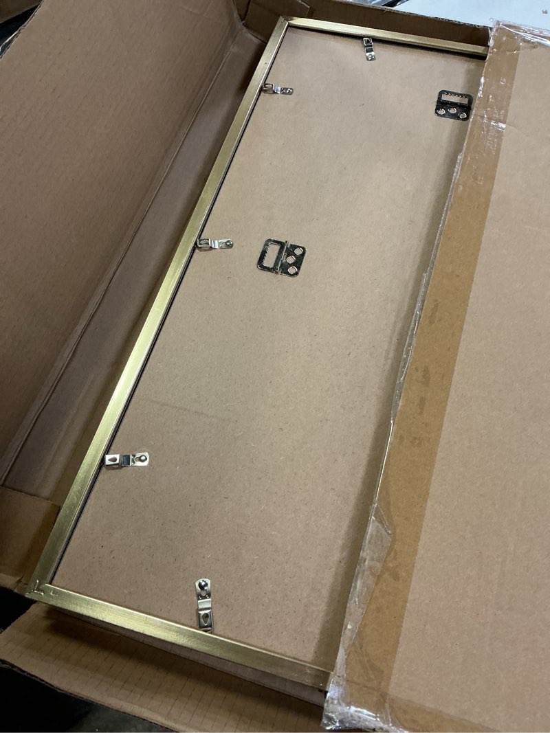 Condition photo showing Good Condition for Matte Gold 14x22 Frame - Set of 3, 14 x 22 Poster Frame with Mat for 12x18, Picture Frames for Artwork, Puzzles, Photos and Movie Posters 14" x 22" / 12" x 18" mat