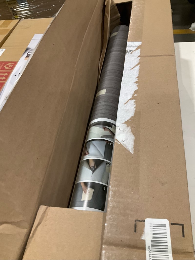 Condition photo showing Good Condition for oxdigi peel and stick vinyl flooring roll 24"x 393"/ 64 sq.ft, self adhesive vinyl floor tiles wood flooring, temporary floor stickers waterproof for living room bedroom kitchen rv, charcoal wood 24"wx 393"l (64 sq.ft) charcoal wood