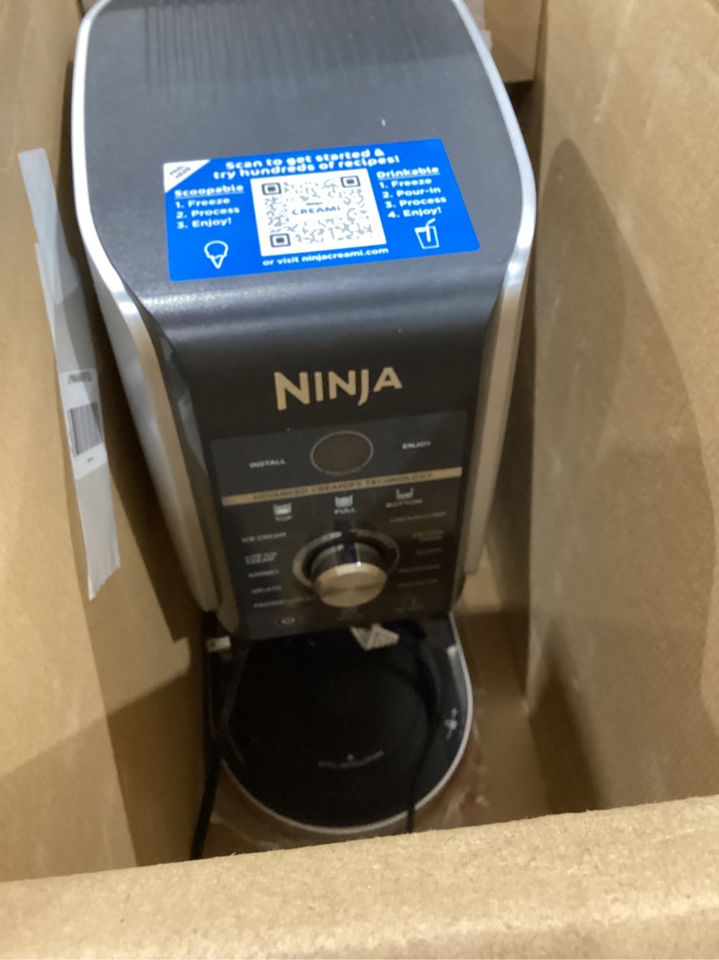 Condition photo showing As Is for ninja creami deluxe ice cream maker, treats and frozen desserts, sorbet, milkshakes, yogurt and more, 11-in-1 programs, xl capacity, includes two 24-oz family-size tubs, silver, nc501