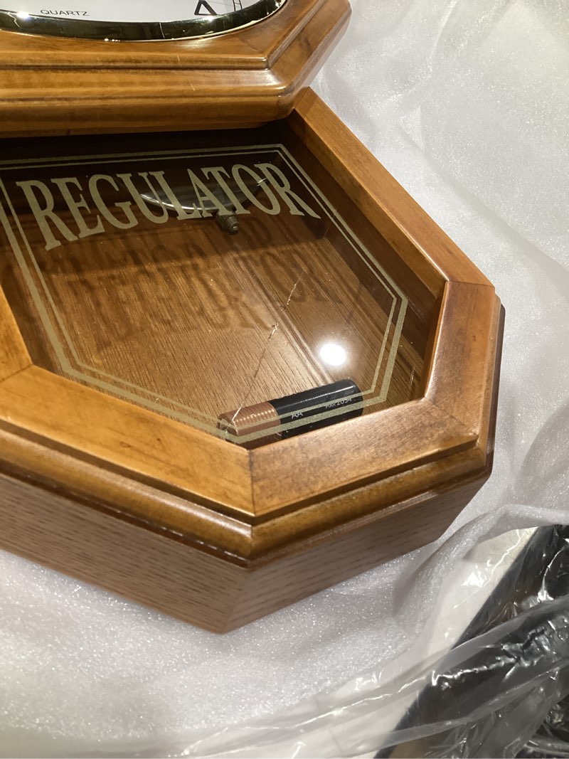 Condition photo showing As Is for (damaged)pendulum wall clock battery operated - 18x11 real wood regulator clock - schoolhouse design with pendulum - quiet, non-chiming - wooden wall decor for living room decor, home, office and gift light wood with arabic numerals