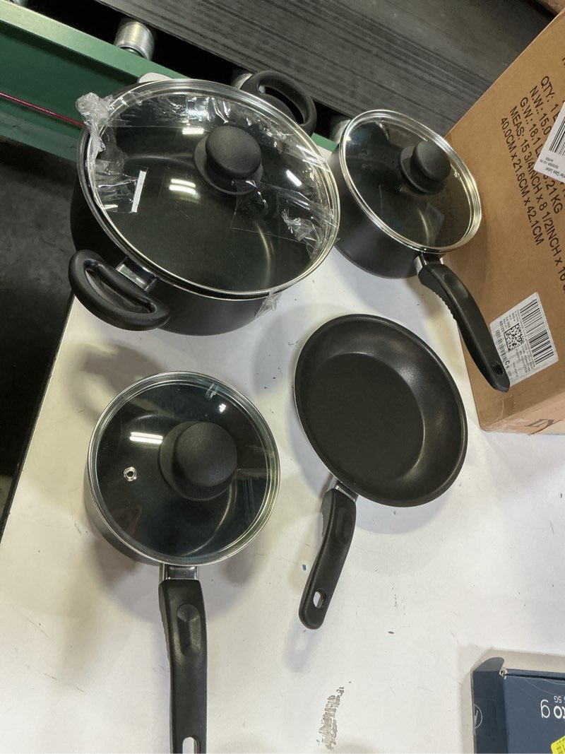 Condition photo showing As Is for mainstays 7 piece non stick aluminium, pots and pans cookware set, black
