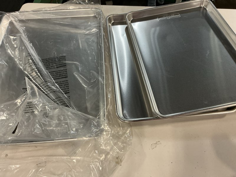 Condition photo showing Good Condition for Nordic Ware Naturals 3 Piece Set - USA Made Aluminum Commercial Quality Sheet Pan for Baking or Roasting, Encapsulated Galvanized Steel Rim Prevents Warping; Half Sheet, Jelly Roll and Quarter Sheet 3-Piece Pan Set