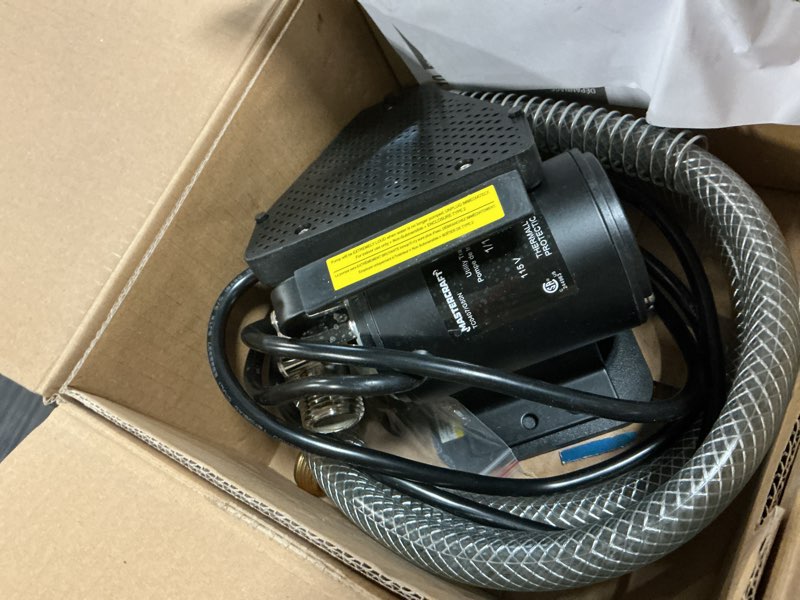 Condition photo showing As Is for acquaer 1/10 hp portable transfer pump with suction attachment and 6ft. garden hose