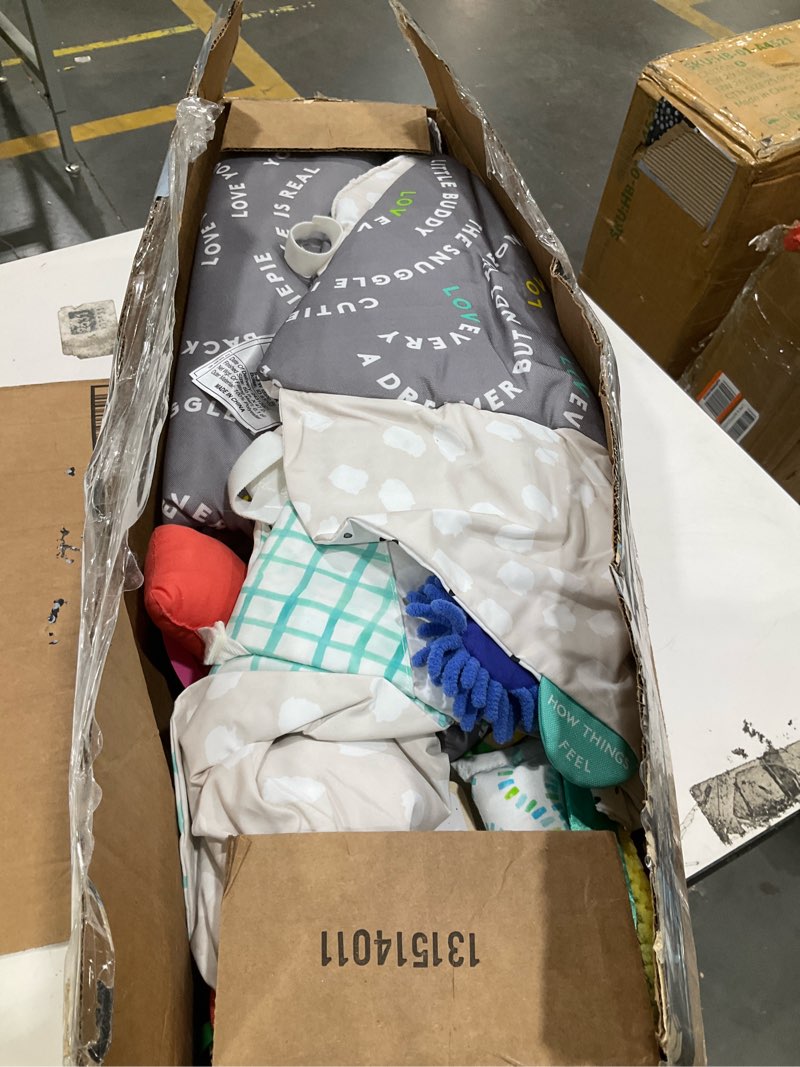 Condition photo showing As Is for lovevery, the newborn gift set, play gym with sensory strands and looker play kit, baby development essentials, ages 0+