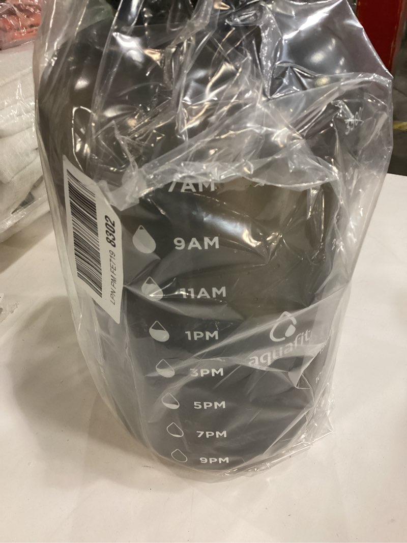 Condition photo showing As Is for AQUAFIT 64 oz Water Bottle with Time Marker, Half Gallon Gym Bottle with Straw, Handle & 2-in-1 Lid 64 Ounces Aqua (gray color)