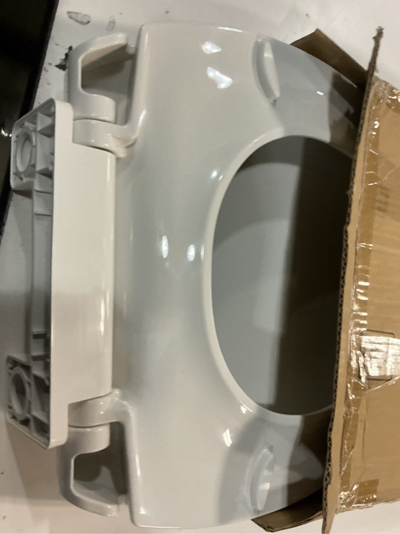 Condition photo showing As Is for durable elongated toilet seat with slow soft close - easy to install and clean, never loosens - white, fits most elongated toilets white elongated without toddler seat