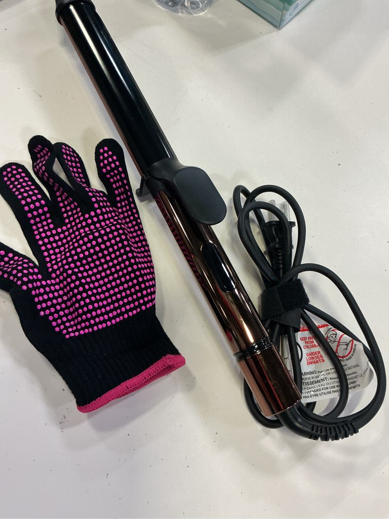 Condition photo showing Good Condition for 1.25 inch long barrel curling iron, extra-long curling wand with 8 heat settings, ceramic curling iron for smooth and lasting styling,suitable for all hair types, dual voltage damage-free styling black gold
