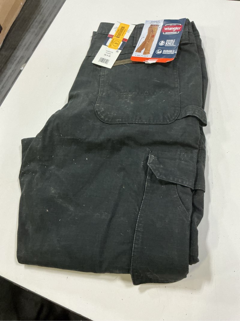 Condition photo showing As Is for wrangler men's relaxed fit black textured cotton cargo work pants (36 x 32)