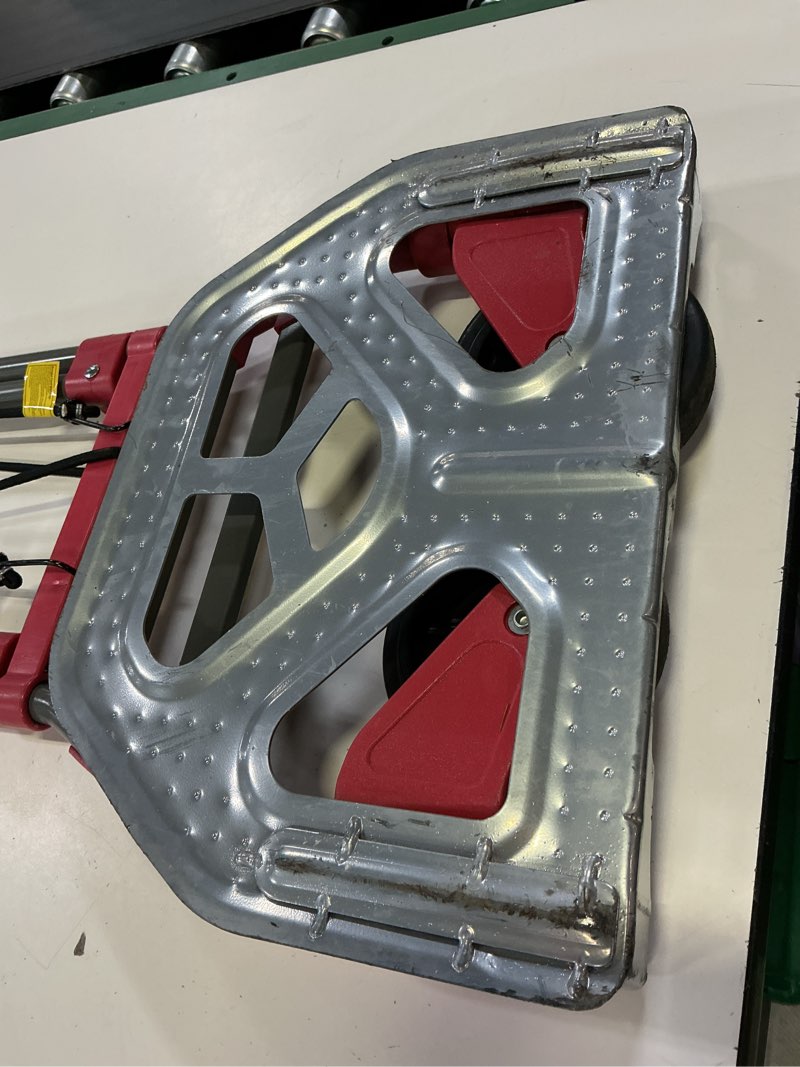 Condition photo showing As Is for milwaukee 150-lb capacity 2 -wheel red steel folding hand truck