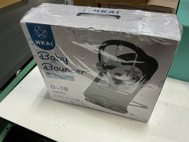 Condition photo showing New/Like New for HKAI Baby Bouncer, Portable Baby Bouncer Seat for Babies 0-18 Months, 100% Cotton Fabrics, 3 Modes of use with Rocker and Stationary Options, Infant Rocker Chair with Hanging Toys-Dark Grey