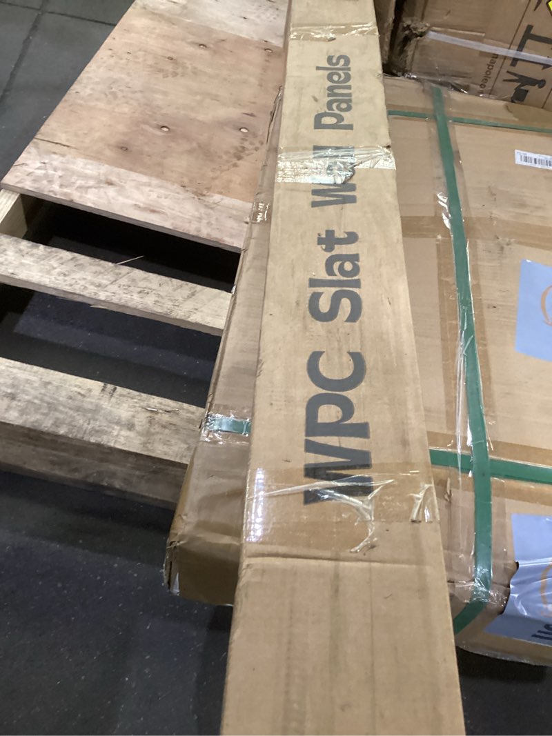 Condition photo showing As Is for OUZUGIE WPC Acoustic Slat Wall Paneling, 8-Pack 114 x 6 Inches 3D Wall Panels for Interior Wall Decor,Living Room,TV Background,Study Room,Office Spaces,Bedroom,Low Grille (Teak)