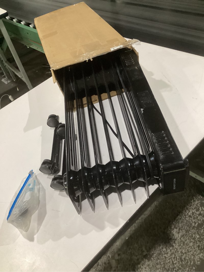 Condition photo showing As Is for (similar to stock photos, used, not tested, incomplete parts)oil-filled heater black