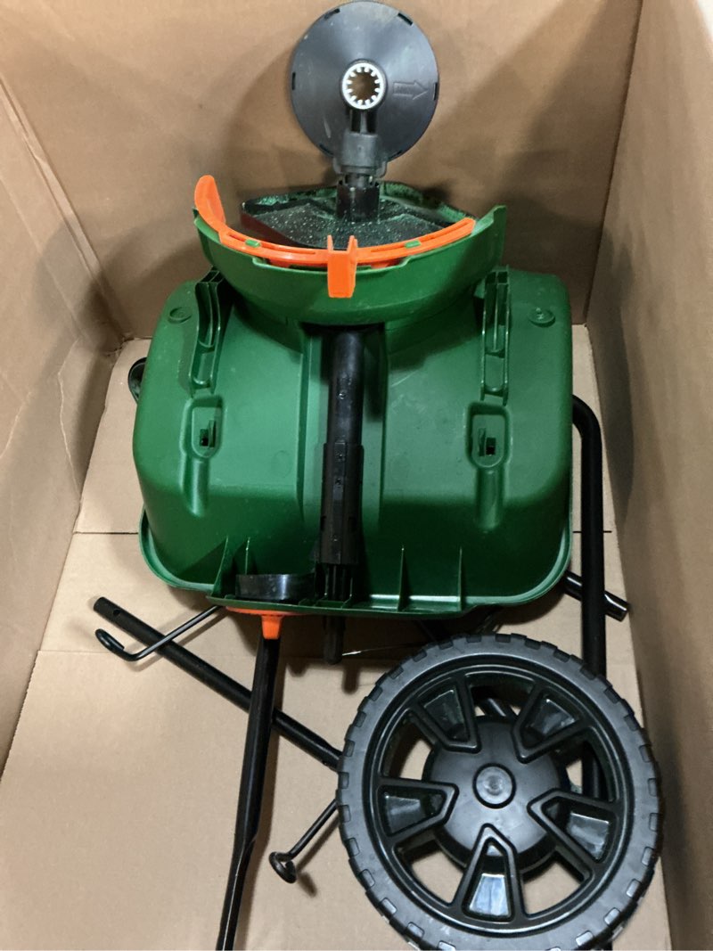 Condition photo showing As Is for scotts turf builder edgeguard mini broadcast spreader for seed, weed and feed, fertilizer, salt, ice melt, push spreader holds up to 5,000 sq.ft. product