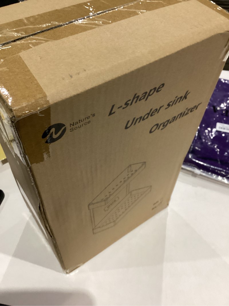 Condition photo showing item condition for 2 Pack Under Sink Organizer 2 Tier Sliding Cabinet Organizers Multi-Purpose Sink Storage Basket L-Shape Narrow Space Storage Shelves with 4 Hook for Kitchen Bathroom Drawer, Black 2 pack Black