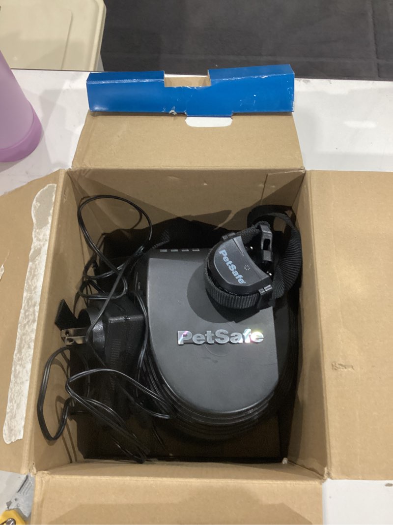 Condition photo showing As Is for petsafe stay & play compact wireless fence, lcd screen to adjust the circular boundary, secure up to 3/4 acre area, use for all your pets, portable system