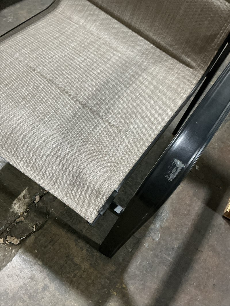 Condition photo showing As Is for stackable black metal frame stationary dining chair with tan padded