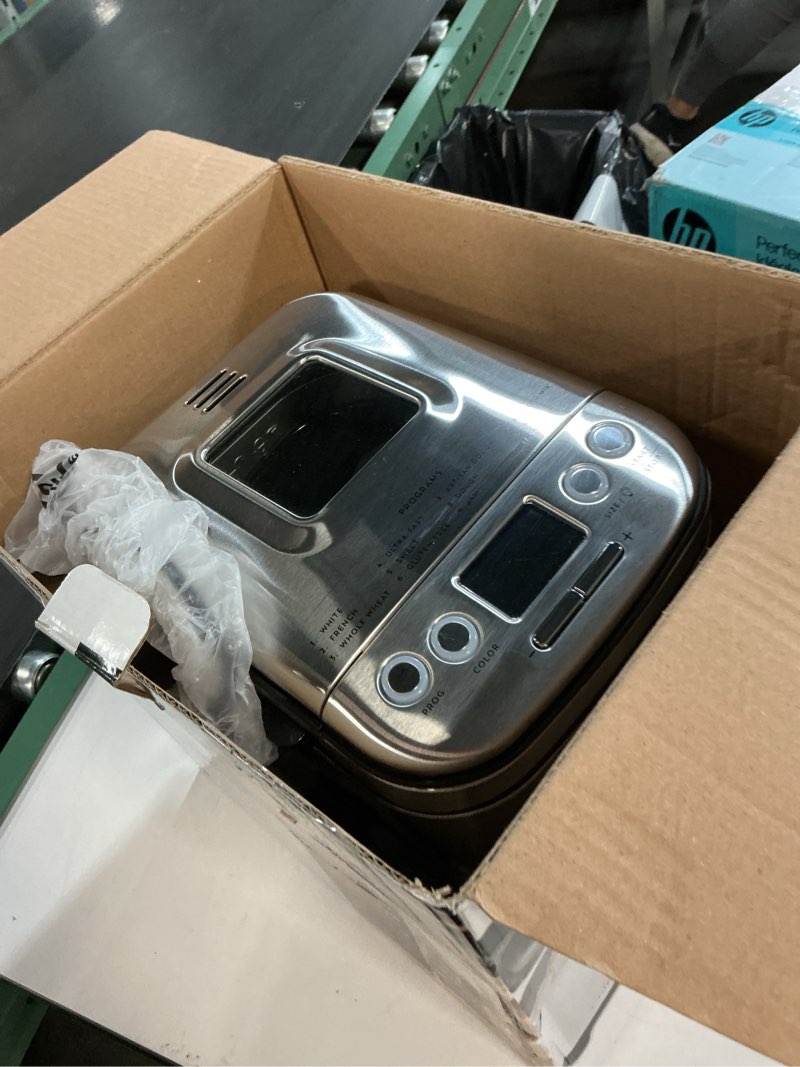 Condition photo showing As Is for cuisinart bread maker machine, stainless steel automatic bread machine with 12 menu options, 3 loaf sizes up to 2 lb., 3 crust colors, removable nonstick baking pan & kneading paddle, cbk-110nas