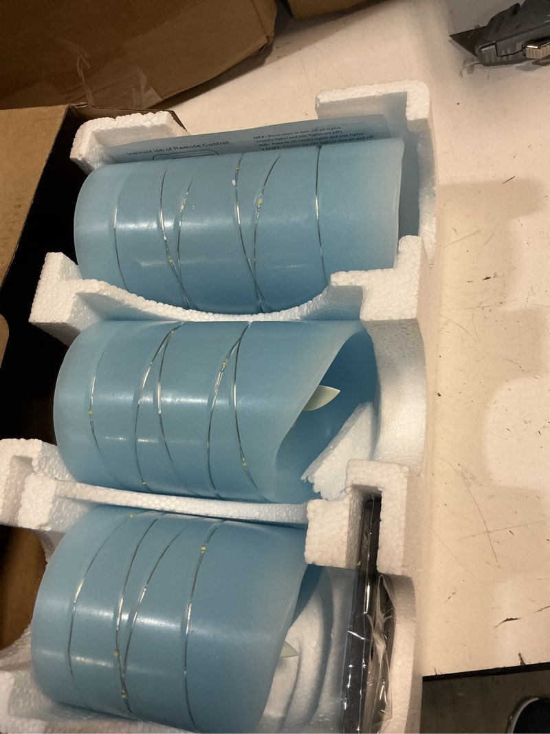 Condition photo showing New/Like New for danip sky blue led flameless candle with embedded starlight string, 3 led candles, 11 key remote control, 24 hour timer function, dancing flame, true wax, battery powered. (sky blue) bluea#1*3