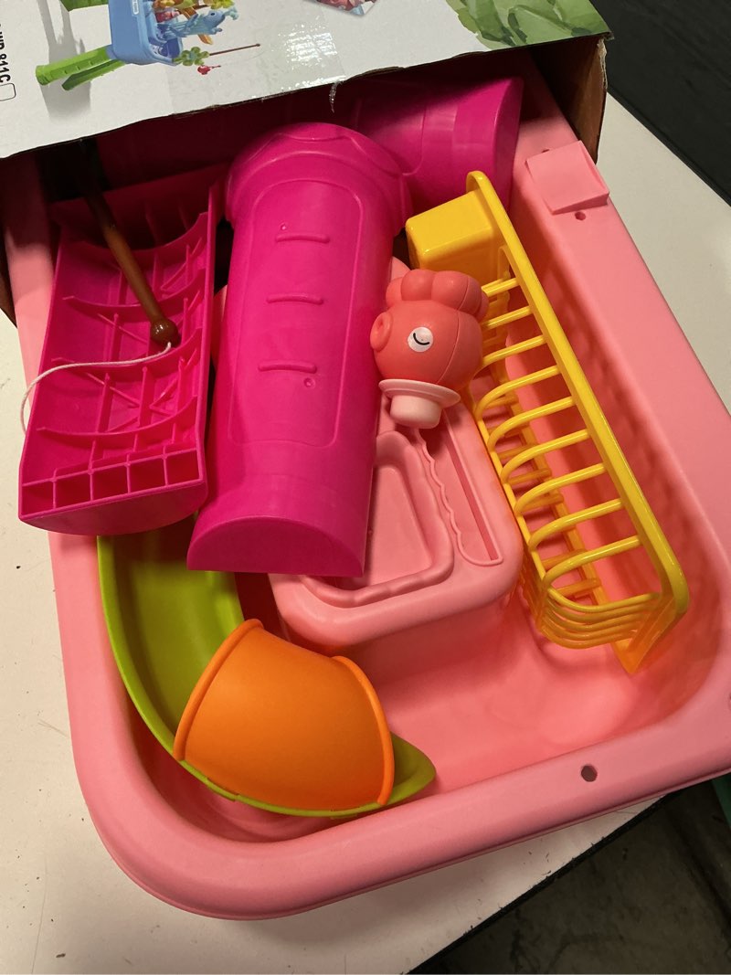 Condition photo showing As Is for 2026 upgraded water table for toddlers 1-3, kids mini play sink toys with running water & electric pump, kitchen sink sensory toy, fishing game outdoor water play table for kids ages 4-8, pink