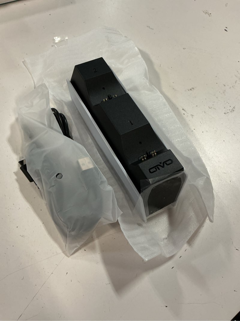 Condition photo showing Good Condition for OIVO PS5 Controller Charger, 2H Fast Charger with 2 Cable Types, PS5 Charging Station for PlayStation 5 Controllers P4 Interactive Figure White 1