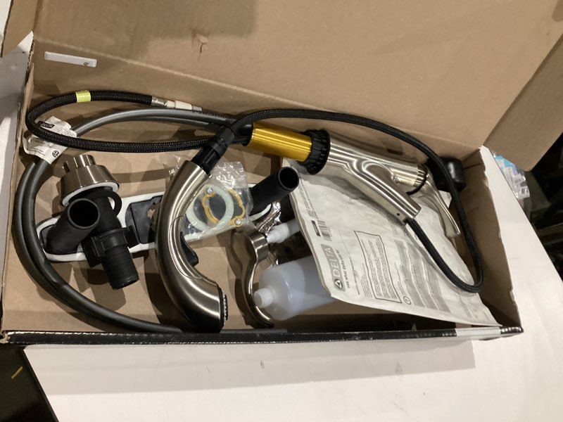 Condition photo showing As Is for single handle pull-out kitchen faucet in stainless