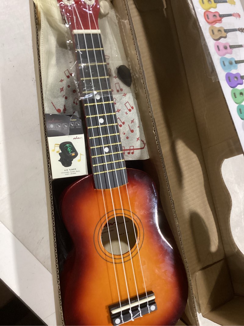 Condition photo showing New/Like New for ADM Ukulele for Beginners Hawaiian Wood Ukelele Kit for Kids Adult Student Starter Professional Ukalelee Pack Bundle with Free Lessons Gig Bag Strap Nylon String Tuner (Sunset, 21 Inch)