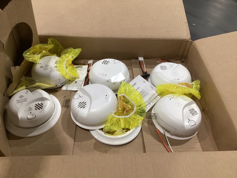 Condition photo showing As Is for first alert smco100v-ac, interconnect hardwire combination smoke & carbon monoxide alarm with battery backup and voice & location alerts, 6-pack 6-pack precision detection