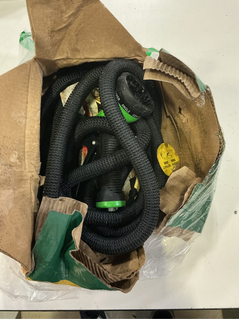 Condition photo showing As Is for flexi hose plus expandable garden hose with 8 function nozzle, 25ft - lightweight retractable garden hose, water hose - no-kink flexibility, 3/4 inch solid brass fittings includes hook & bag
