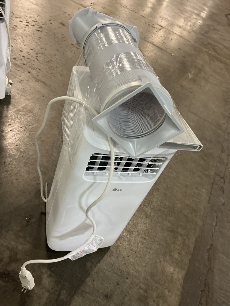Condition photo showing As Is for 6,000 btu (sacc) / 8,765 btu (ashrae) portable air conditioner cools up to 250 sq. ft.