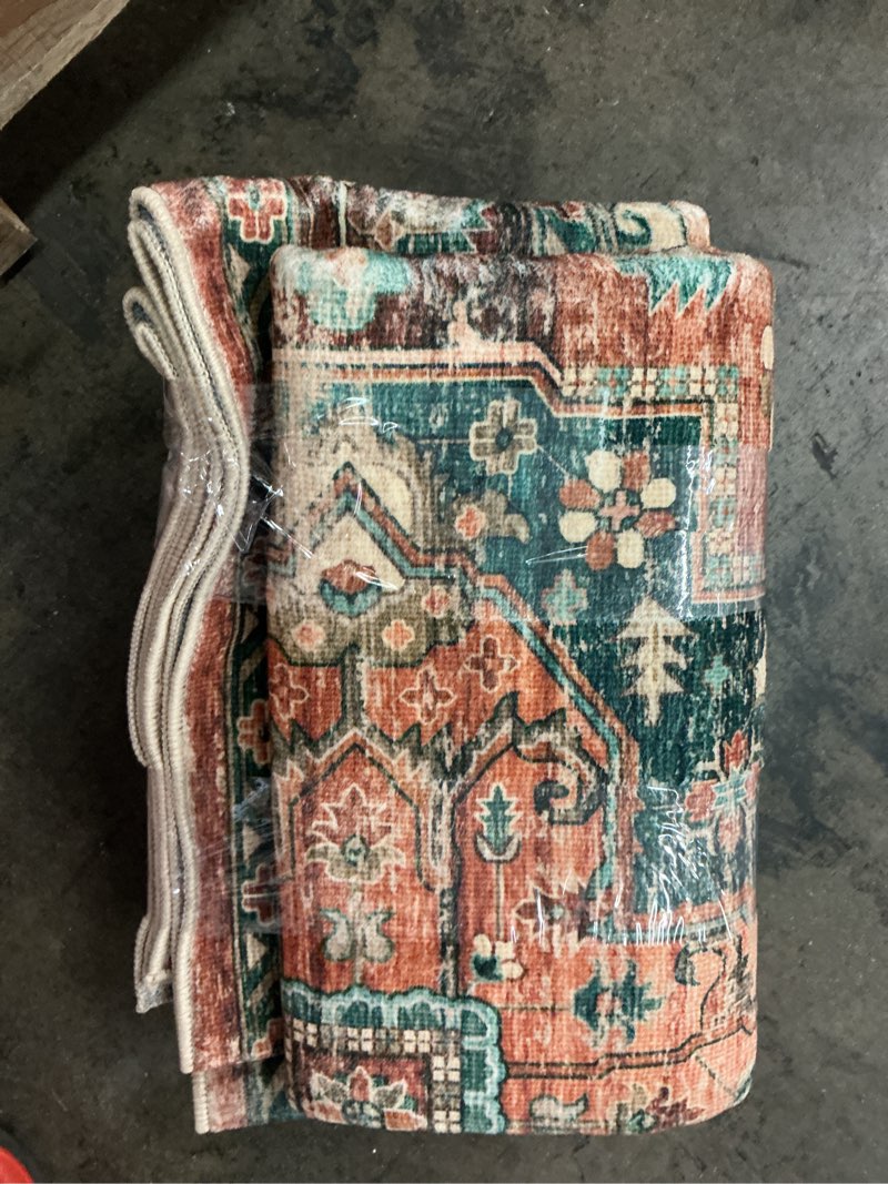 Condition photo showing As Is for brown multi colored area rug