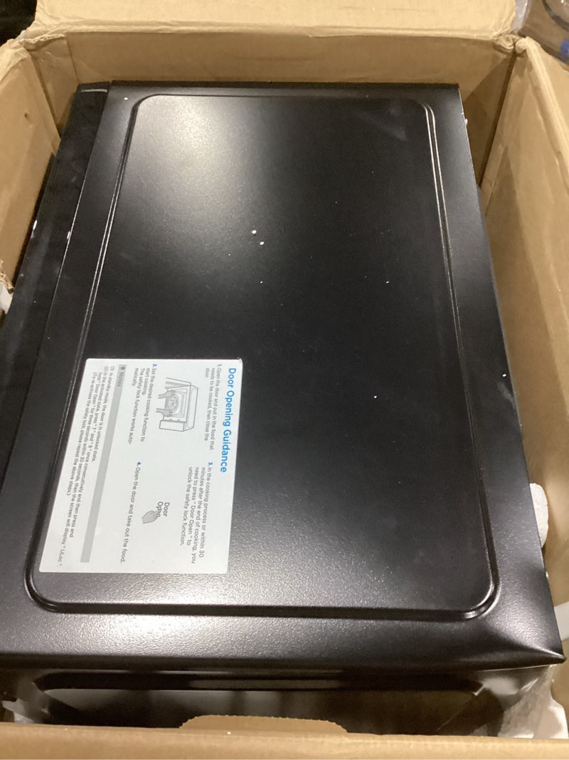 Condition photo showing Good Condition for farberware 1.1 cu. ft. countertop microwave oven – 1000 watts power, auto cook settings, defrost, easy clean and child safety lock - stainless and black 1.1 cu. ft. black stainless