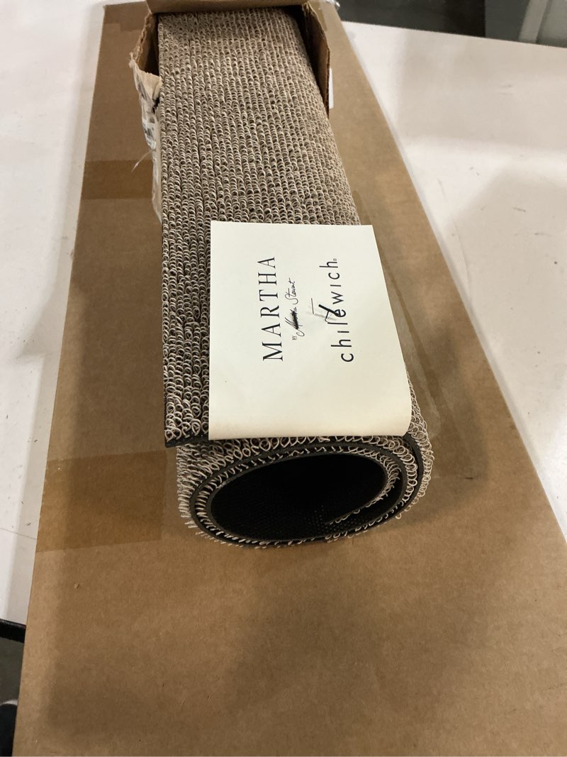 Condition photo showing New/Like New for chilewich martha by martha stewart heathered shag doormat in flax - 18”x28 - easy care welcome mat - premium indoor/outdoor tufted rug for entry, kitchen, bath, pool with weatherproof backing flax 1'6" x 2'4" (rectangular)