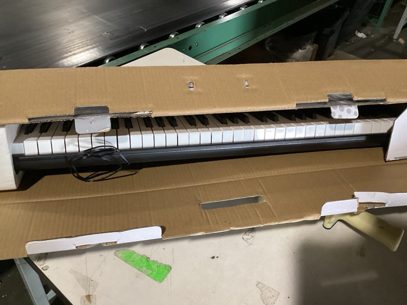 Condition photo showing Good Condition for rockjam compact 61 key keyboard with sheet music stand, power supply, piano note stickers & simply piano lessons 61 key compact