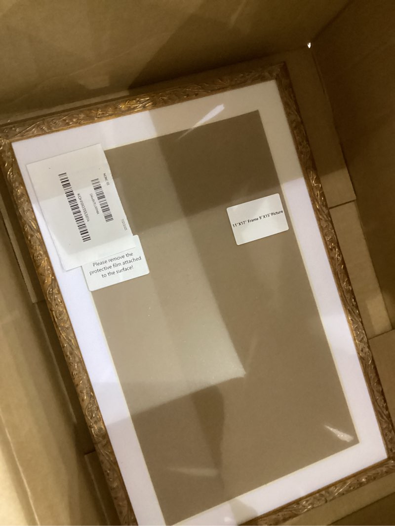 Condition photo showing Good Condition for ArtXO 11"x17" Picture Frame Wooden, Display Pictures 9"x15" with Mat or 11"x17" Without Mat, Gold Ornate Frame Poster Frames,Hanging Photo Frame Wall 11"x17" Gold09