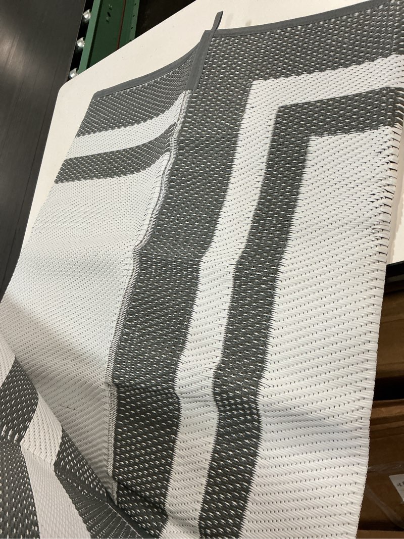 Condition photo showing Good Condition for happytrends,outdoor rug,patio rug,reversible portable plastic straw rug,camping rugs for outside rv,large waterproof area rugs for patio,deck,picnic,porch,balcony(6'x 9',white&gray)