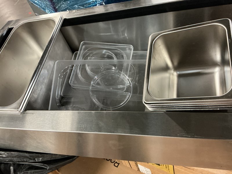 Condition photo showing As Is for 47-inch countertop refrigerated condiment, with 304 stainless steel two 1/3 pans & four 1/6 pans refrigerated condiment prep station, led display sandwich & salad & pizza bar, glass guard etl