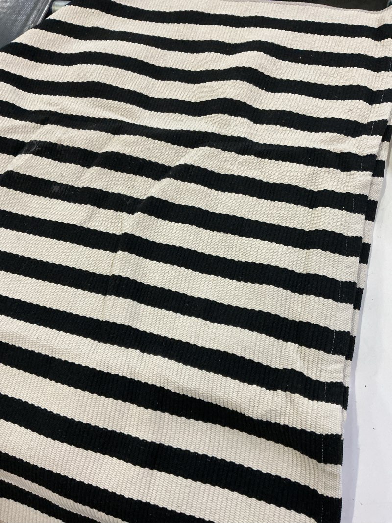 Condition photo showing Good Condition for ojia outdoor rug 3'x5', front door mat outdoor entrance machine washable rugs cotton hand woven striped entryway rugs indoor door mat black and cream white area rug for porch/backyard/outside decor 3' x 5' (rectangular) black/cream
