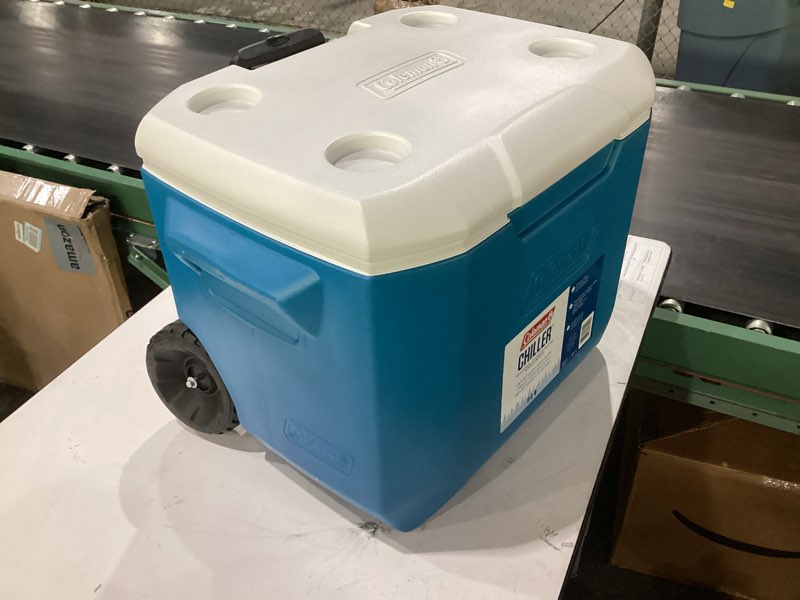 Condition photo showing As Is for **missing one wheel**coleman chiller 9/16/30/48/60qt cooler with ice retention, leak resistant, great for camping, concerts, sports, and more ocean blue 60qt