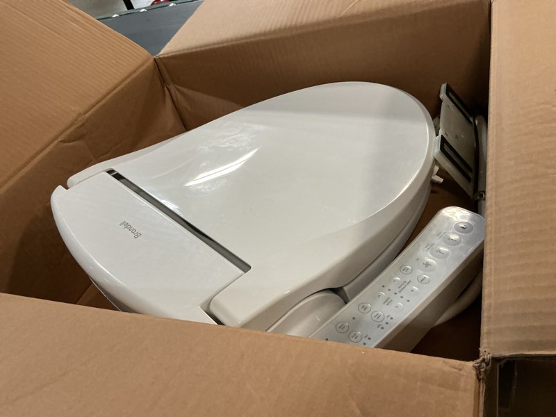 Condition photo showing As Is for brondell se400-rw swash se400 electric bidet toilet seat with heated seat, oscillating stainless steel nozzle, warm air dryer, night light, gentle close lid, white side arm control, round white side arm control round