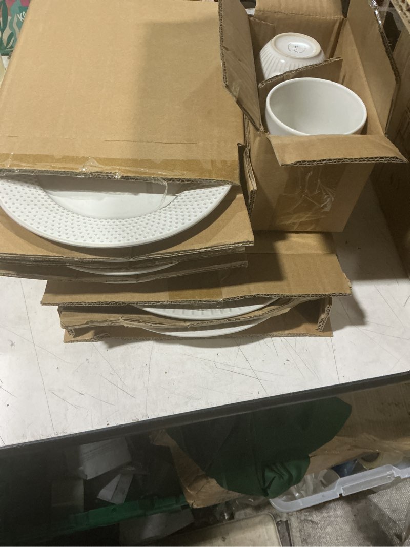 Condition photo showing As Is for elama market finds 16 piece round stoneware dinnerware set in embossed white