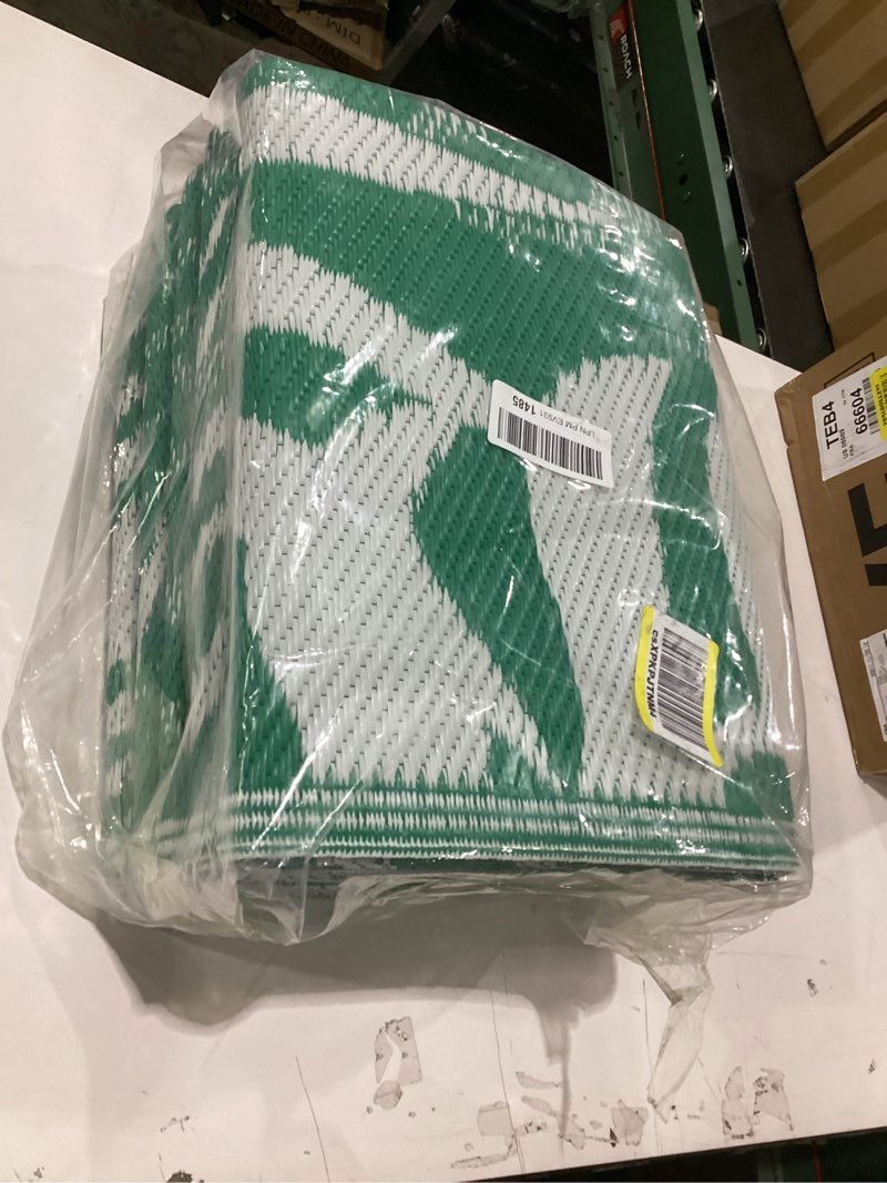 Condition photo showing New/Like New for GENIMO Outdoor Rug 5' x 8' Waterproof for Patios Clearance, Reversible Outdoor Plastic Straw Camping Rug Carpet, Large Area Rugs Mats for RV, Picnic, Backyard, Deck, Balcony, Porch, Dark Green&White