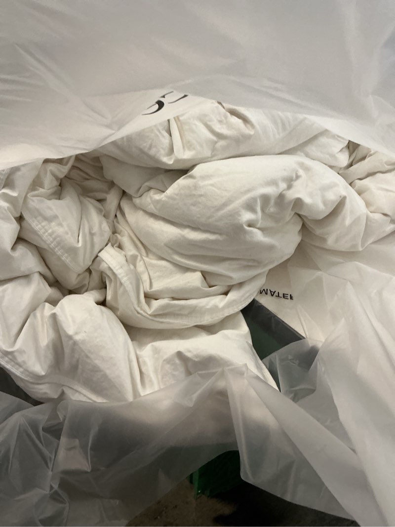 Condition photo showing As Is for premium down comforter, king/cal king, down