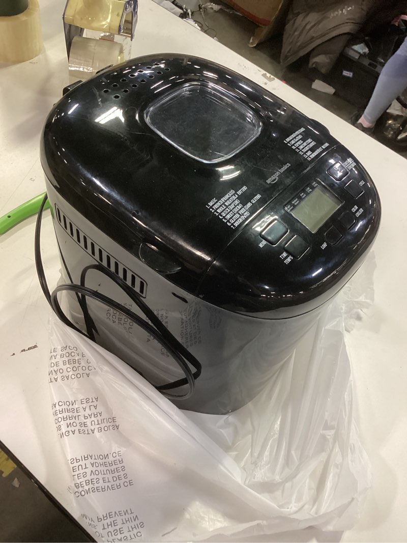 Condition photo showing As Is for Amazon Basics Programmable Bread Maker, 2 Pound Non-Stick Automatic Bread Making Machine, 14 Settings for Breads, Doughs, Gluten-Free Options and More, LCD Display, Black