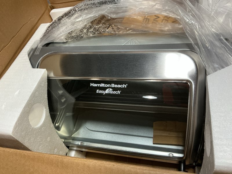Condition photo showing Good Condition for Hamilton Beach Easy Reach 4-Slice Countertop Toaster Oven With Roll-Top Door, 1200 Watts, Fits 9” Pizza, 3 Cooking Functions for Bake, Broil and Toast, Silver (31344DA) Silver 4-Slice